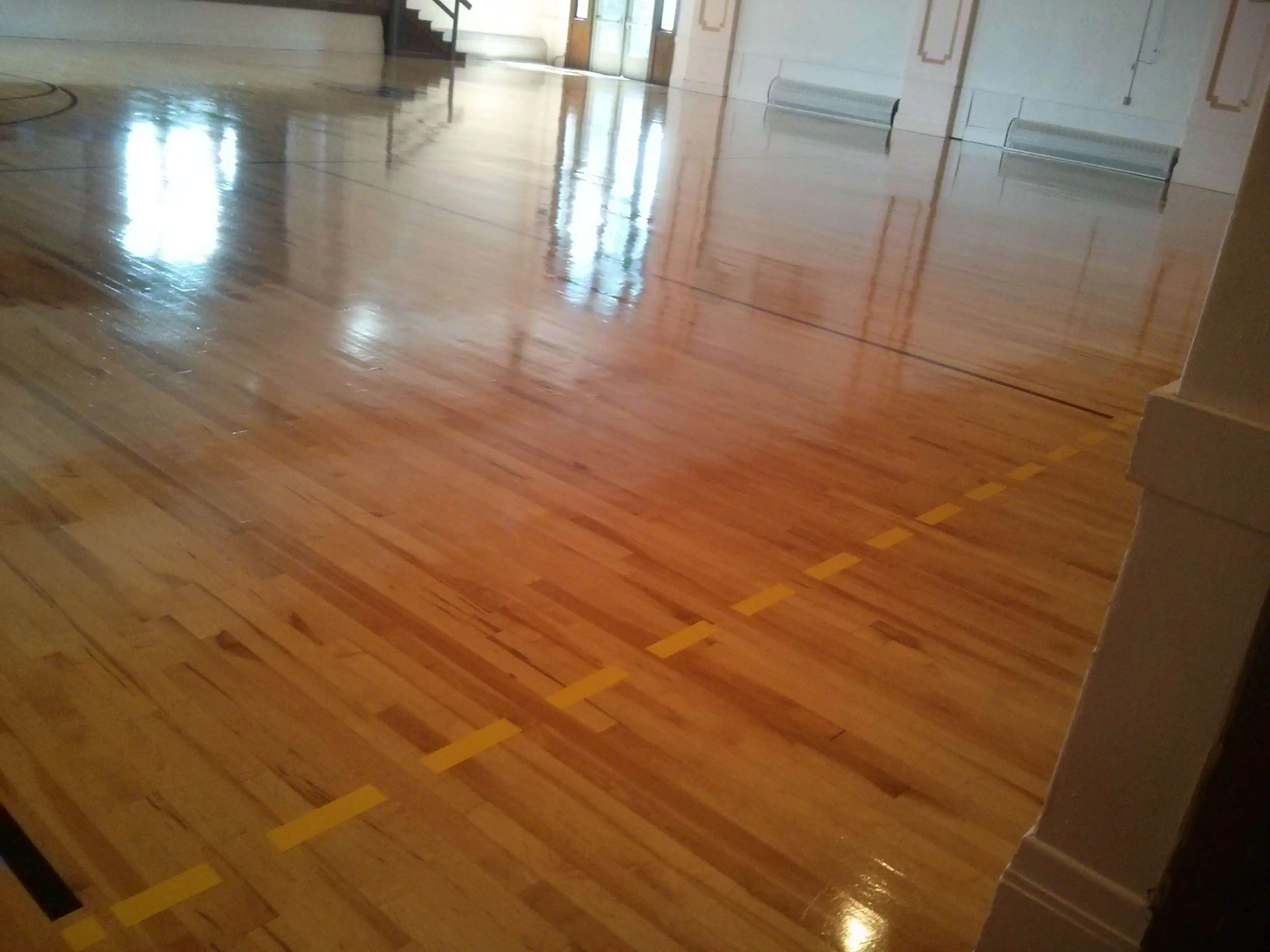 wood-gym-floor-scrub-and-clear-high-gloss-gym-coating-services-in-minneapolis-mn
