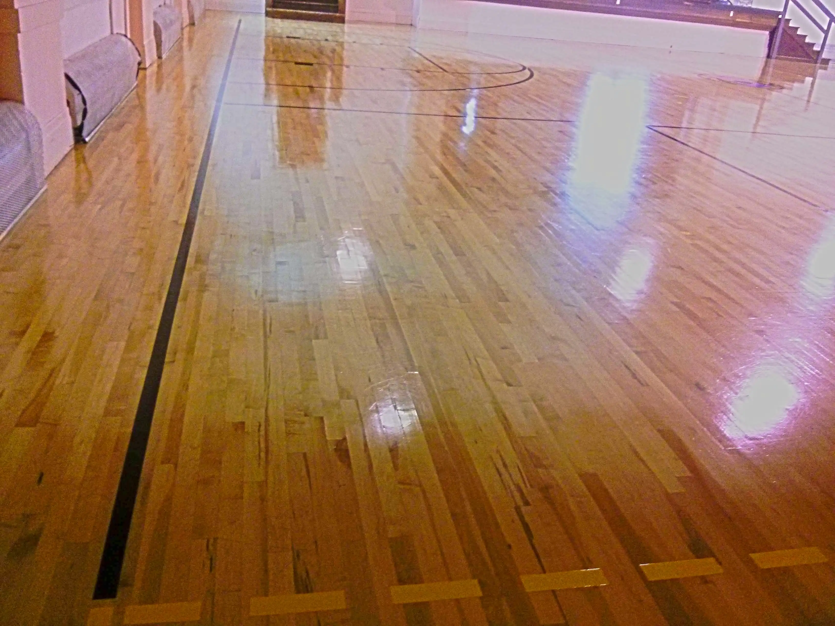 wood-gym-floor-scrub-and-clear-high-gloss-gym-coating-services-in-minneapolis-mn
